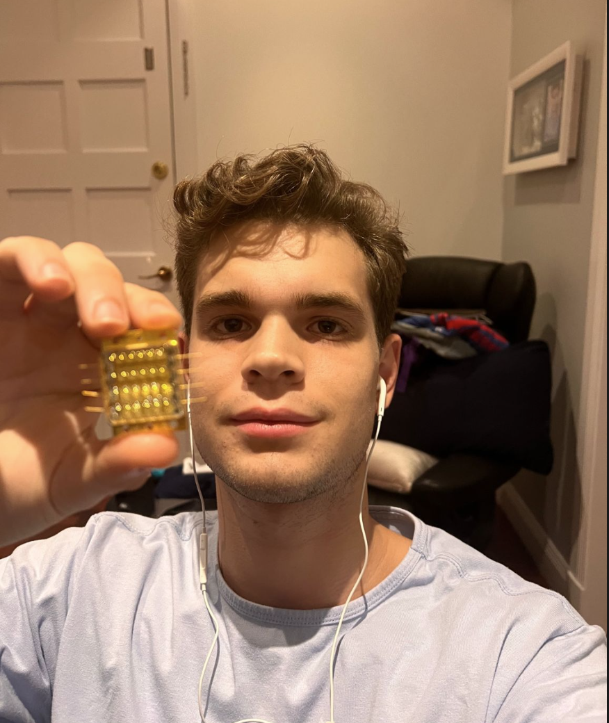 Nicolas holding laser receiver hardware
